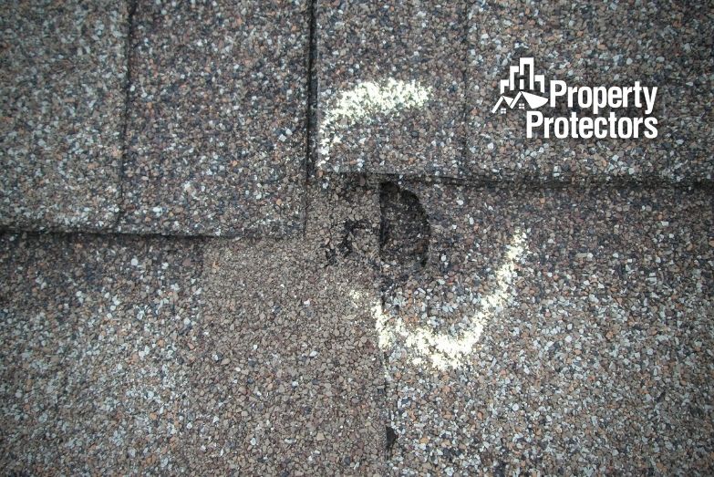 What does roof storm damage look like?